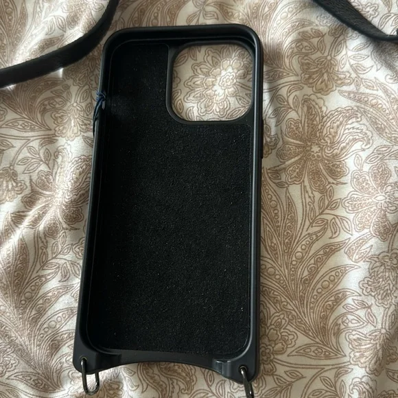 Bandolier case for iPhone crossbody case and AirPods case.